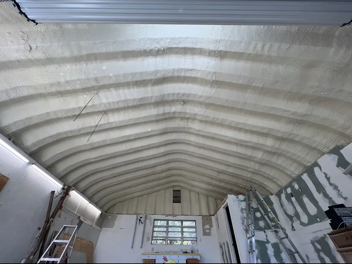 Spray polyurethane foam applied to the underside of a metal roof deck in Lakeway